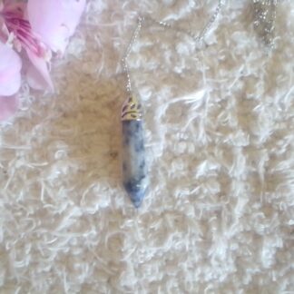 Blue and white sodalite stone point pendulum.