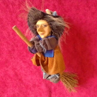 Witch flying a broom